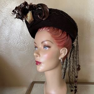 IMPRESSIVE 1940s' BROWN FELT HAT WITH FEATHERS, GOLD TRIM + DOTTED VEILING